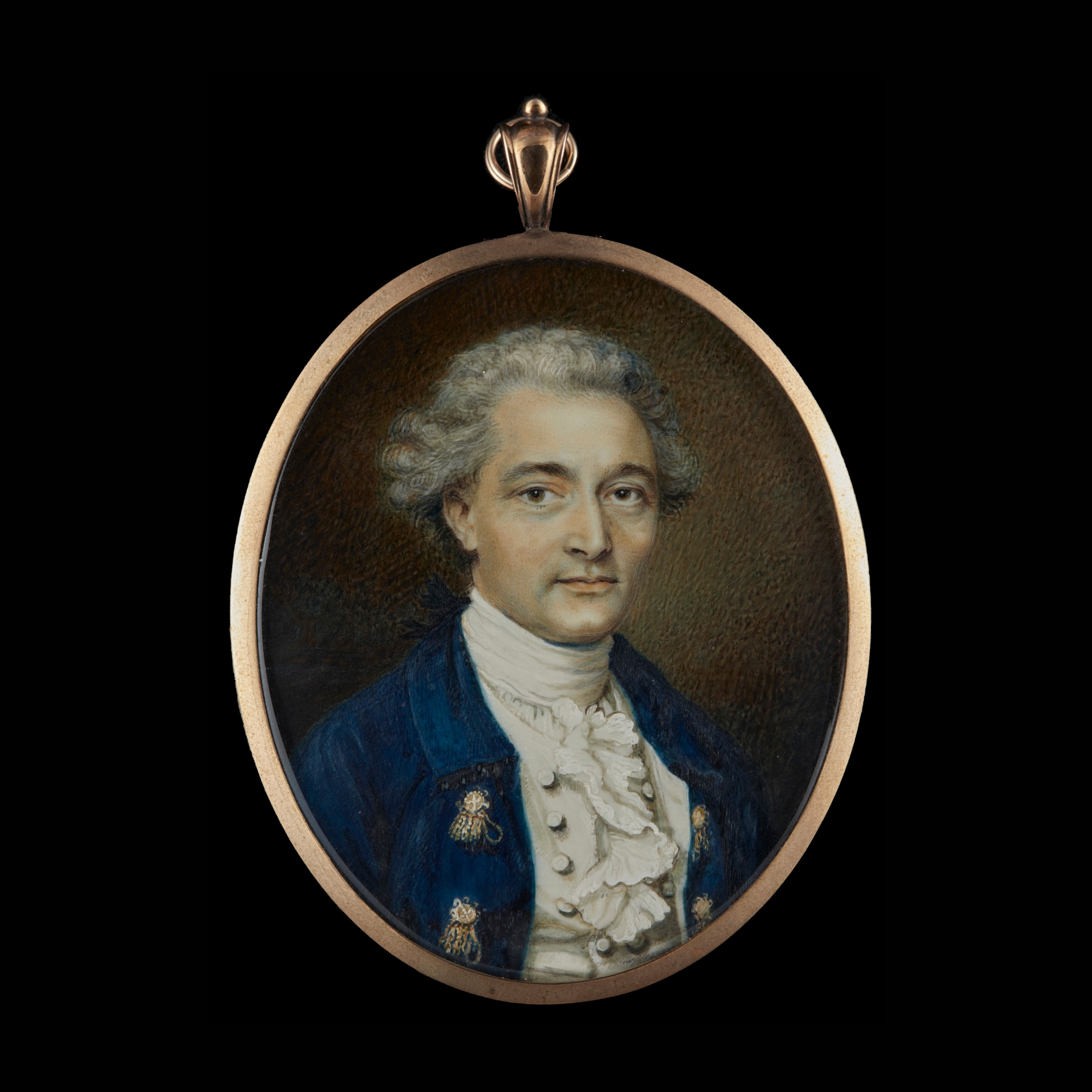 Portrait miniature of a Gentleman, wearing blue coat with braided buttons, white waistcoat and frilled shirt with stock, his hair powdered and worn 'en queue'